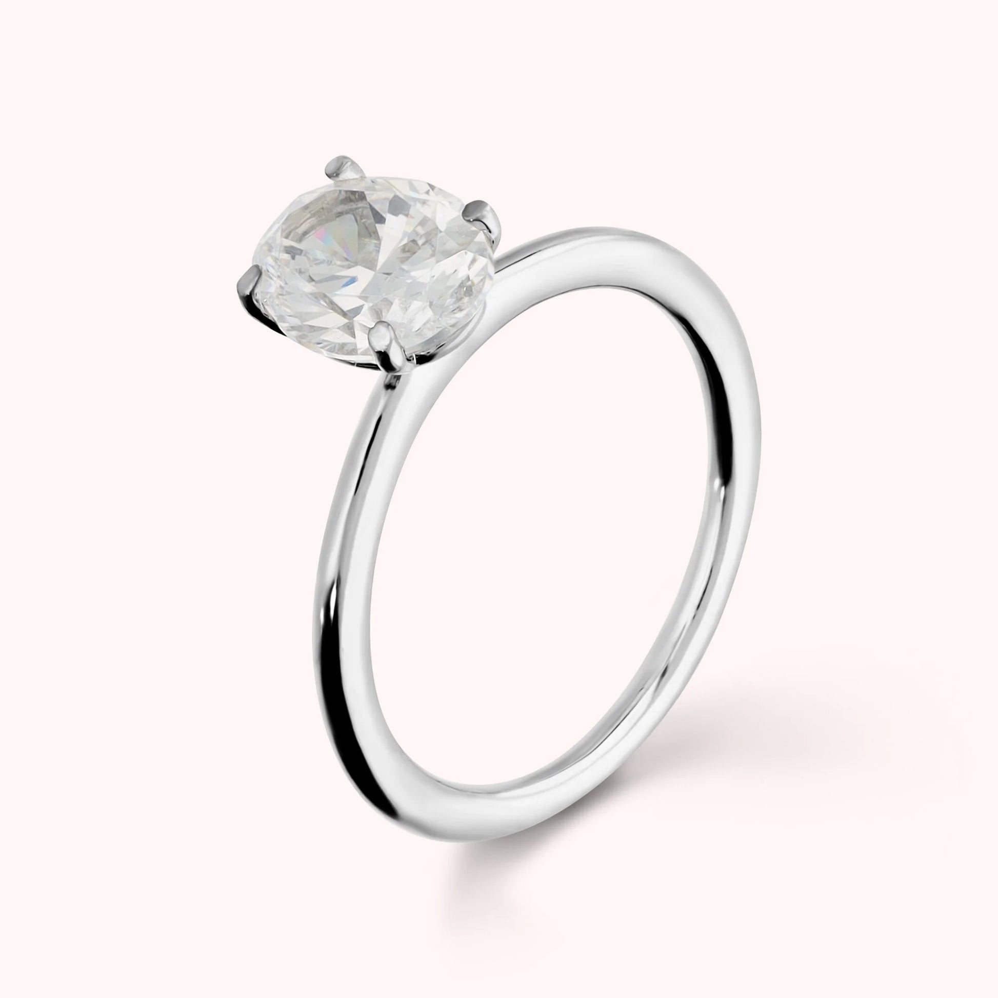 Solitaire Ring Moments of Light with White Cubic Zirconia Oval