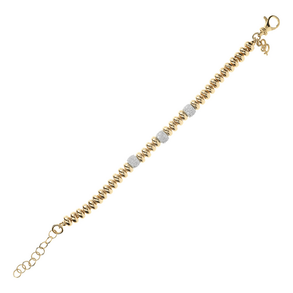 Golden bracelet with alternating pavé elements in Cubic Zirconia