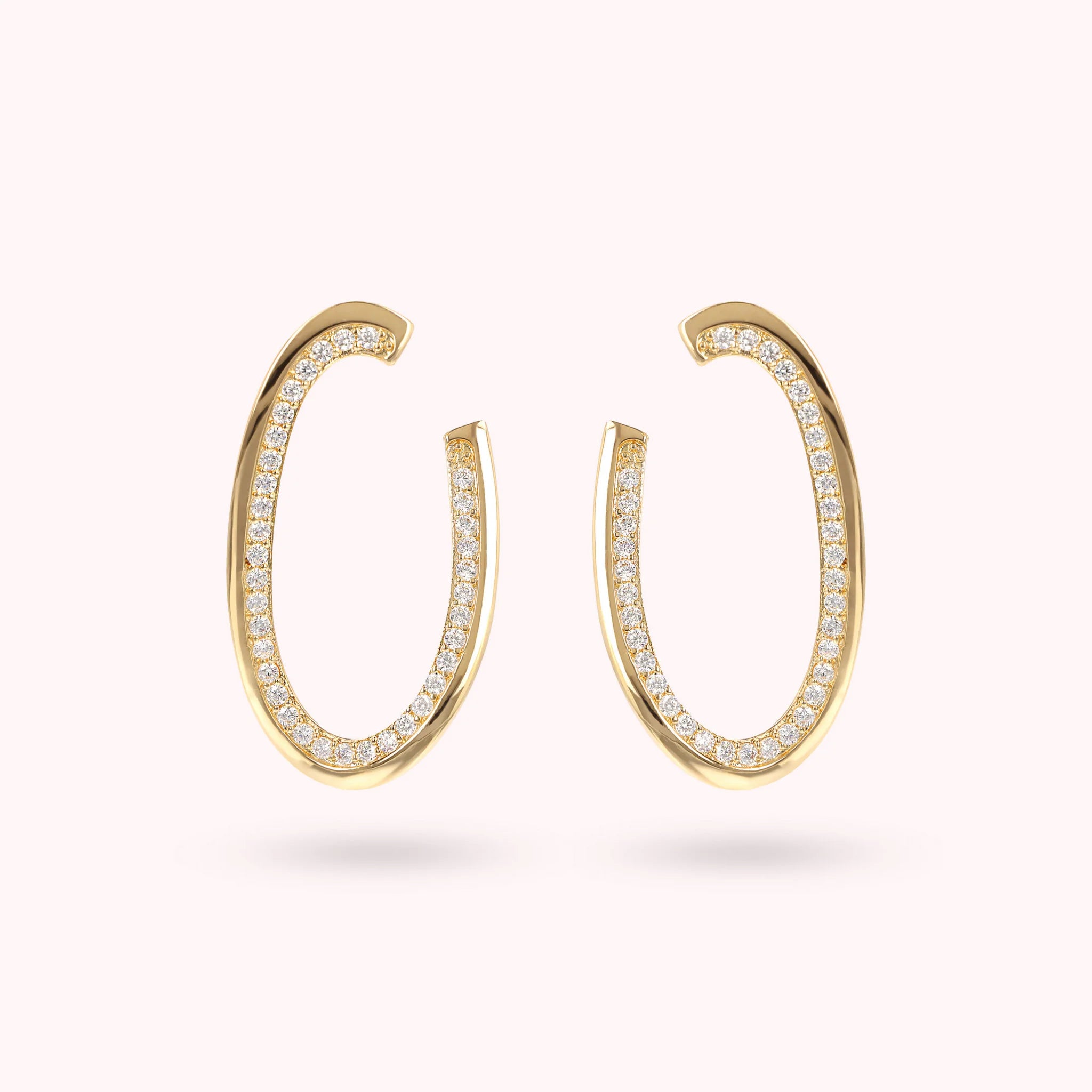 Golden Oval Dangle Earrings with Cubic Zirconia