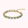 Golden Tennis Bracelet with Green and Blue Mosaic Cut Prisma Gems