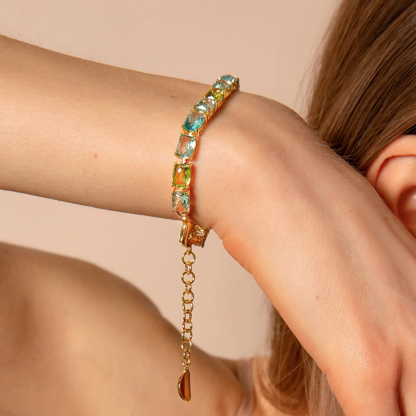 Golden Tennis Bracelet with Green and Blue Mosaic Cut Prisma Gems