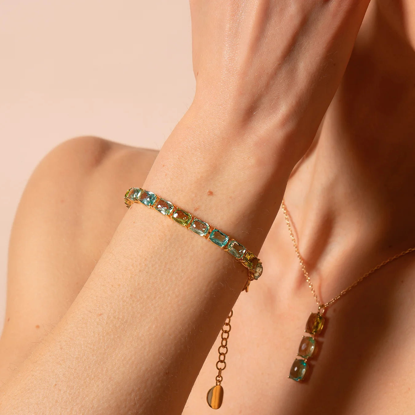 Golden Tennis Bracelet with Green and Blue Mosaic Cut Prisma Gems