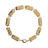 Goldenes Étoile-Armband mit rechteckigen Elementen und Lichtpunkten aus Zirkonia